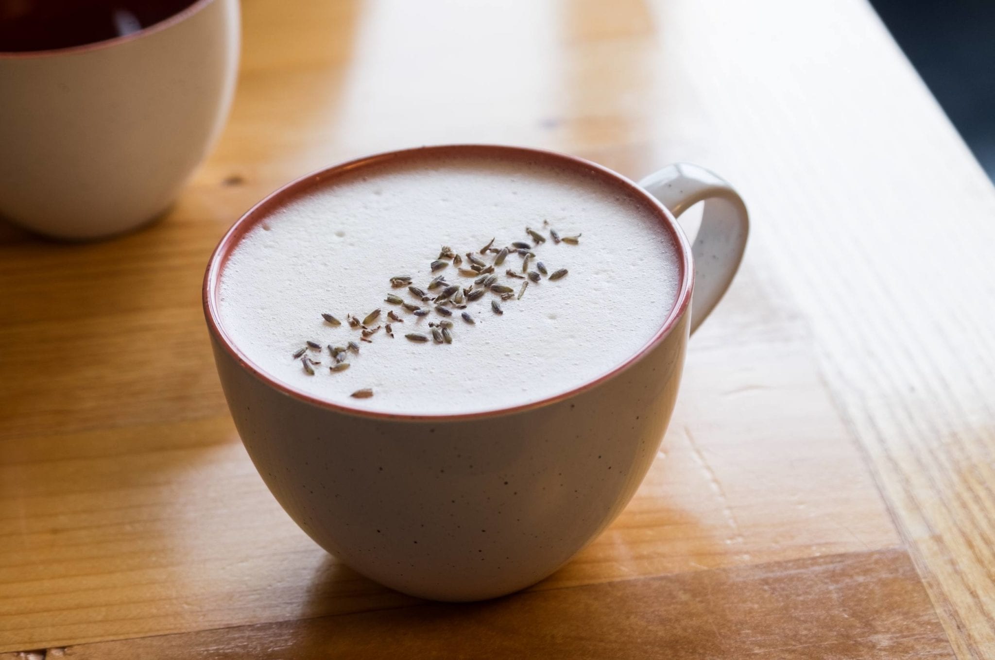 A latte topped with lavender seeds (which are not tasty).